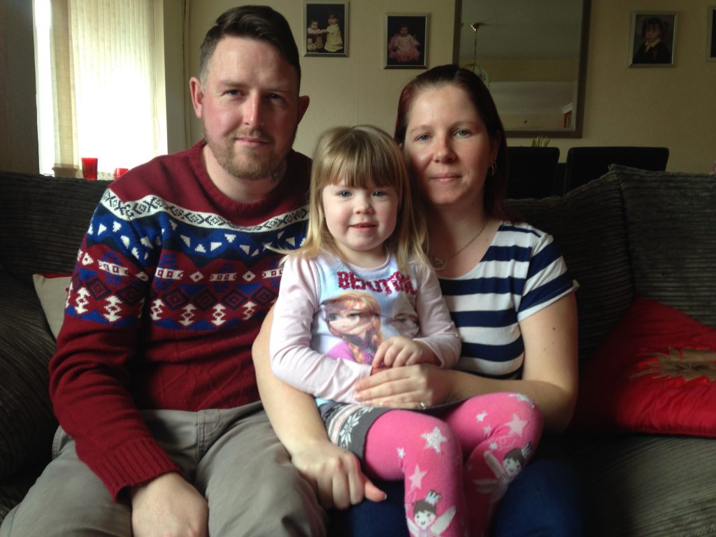 Brooke, now three, with her mum and dad.