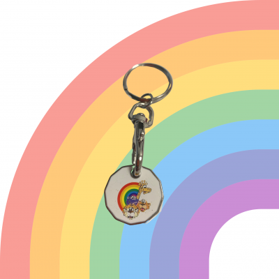 ID: White background with a faded rainbow with an image of a silver trolley coin with a photo of cartoon animals in the middle.