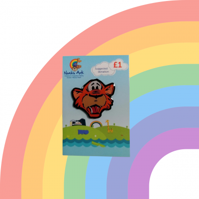ID: White background with a faded rainbow. Noah's Ark Charity tiger badge in the forefront on blue and green backing card.